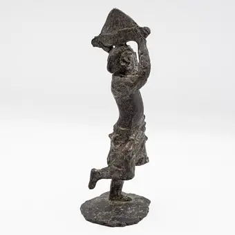 Brutalist bronze figure.