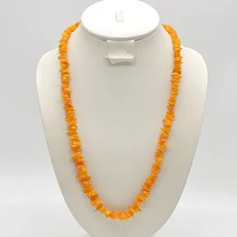 ENDLOSCOLLIER AUS BUTTERSCOTCH-BERNSTEIN, POLIERTE PERLEN, CA. 65CM, 20. JAHRHUNDERT.