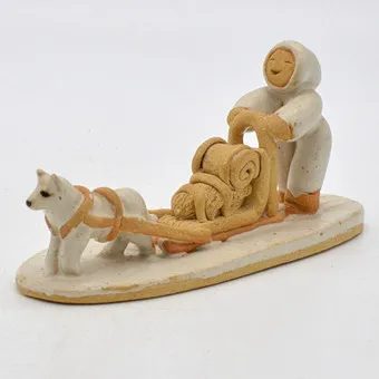 BETTI BOUMANN. INUIT WITH DOG SLED, CERAMIC SCULPTURE, 1985, NANAIMO BC, CANADA.