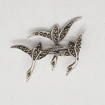 DESIGNER BROOCH WITH MARCASITE, THREE BIRDS, STERLING SILVER SETTING, CIRCA 1950.