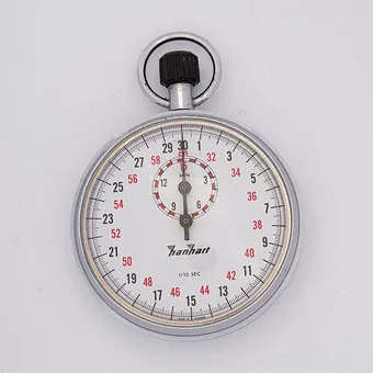 HANHART KRONENSTOPPER, ANTIMAGNÉTIQUE AVEC COMPTEUR 15 MINUTES, 1/10 SECONDE, ÉCHELLE 30 MINUTES ET ÉCHELLE ROUGE DE 32-60, AIGUILLES BLEUIES, BOÎTIER NICKEL, MÉCANIQUE.