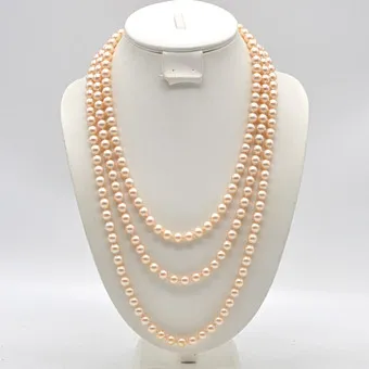 LANGES PERLENCOLLIER, EINZELN GEKNÜPFT, ENDLOSKETTE, GOLDENE FARBE, 20. JAHRHUNDERT.