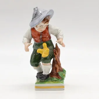 ERNST BOHNE & SÖHNE. "BOY WITH CHICK", THURINGIAN PORCELAIN FIGURE, POLYCHROME, GERMANY, CIRCA 1950.