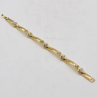 GROSSÉ, VINTAGE MODESCHMUCK, VERGOLDETES GLIEDERARMBAND MIT STRASSSTEINEN, UM 2000.