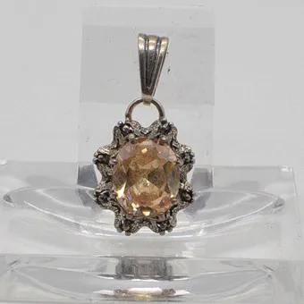 Antique necklace pendant with oval-cut heliodor, sterling silver setting, stamped "P.SS", early 20th century.