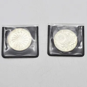 Two historical coins: spiral and Olympic fire, Germany, Munich, 1972.