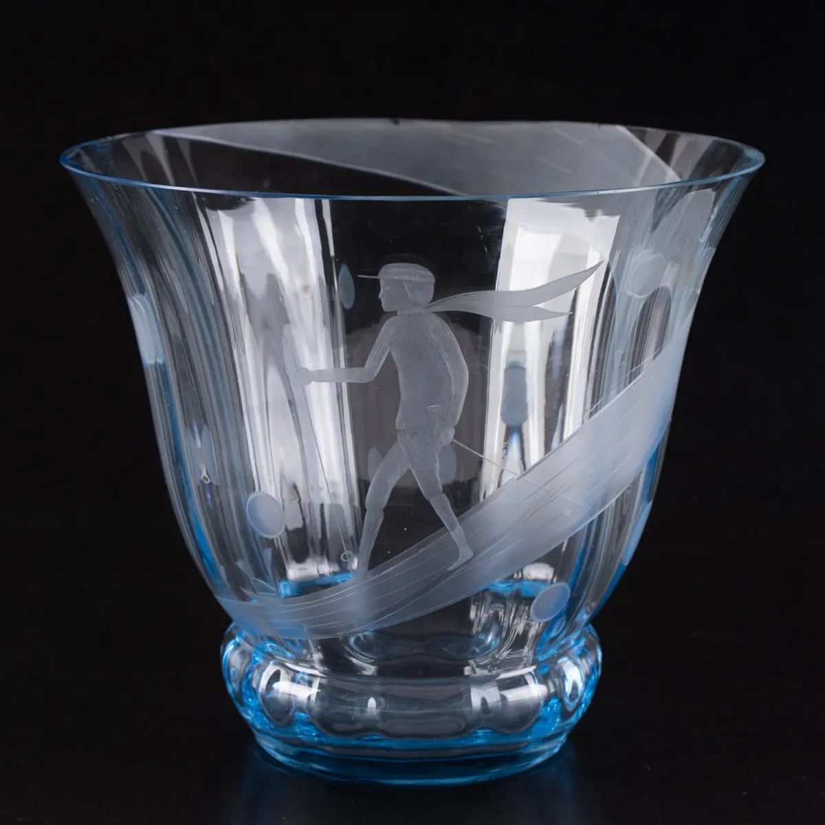 Bluish glass vase with skier decor probably 1930s, height approx. 18.5 cm, diameter approx. 21 cm. Rim partially...