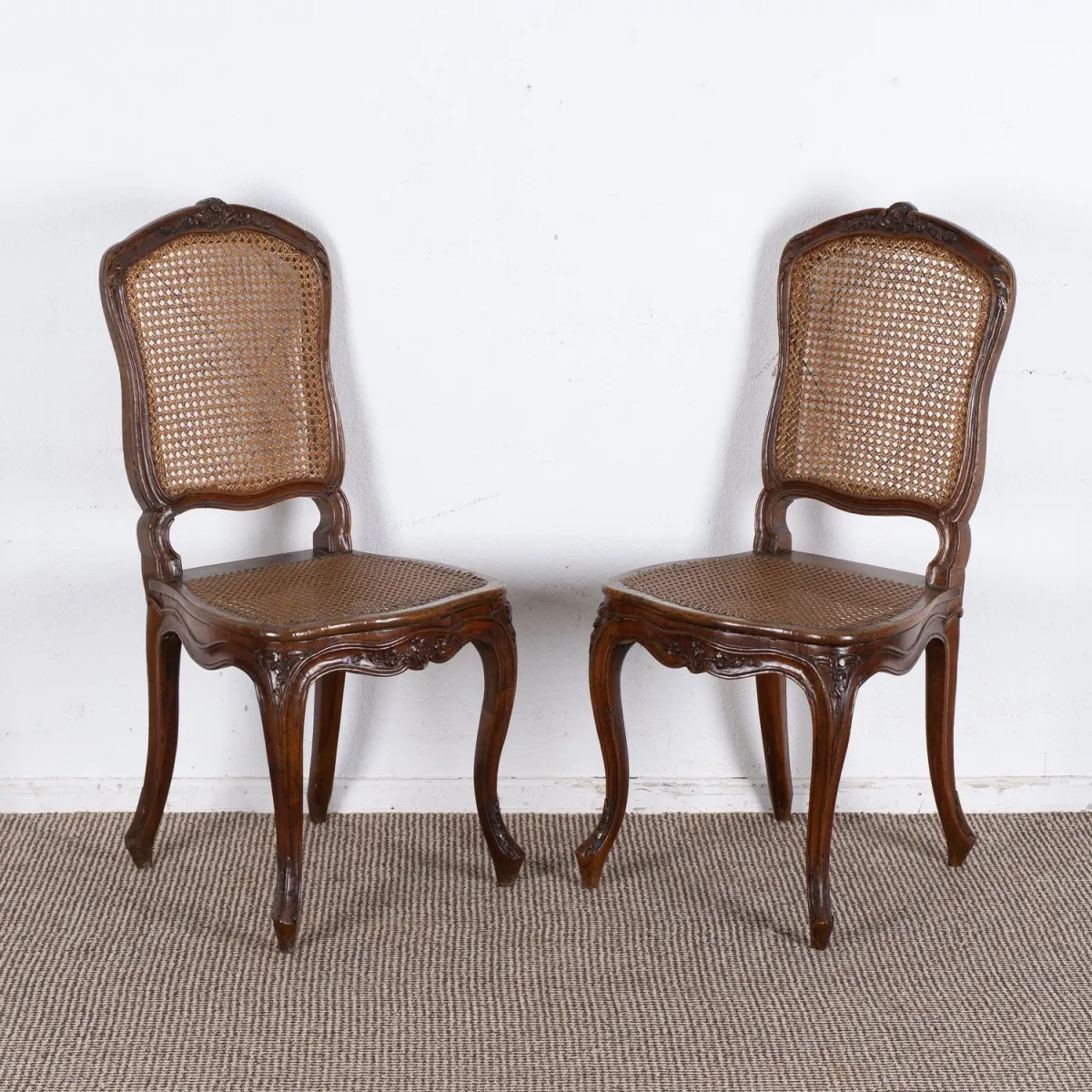 Pair of chairs, walnut, Louis XV, 18th c., seat and back with well-preserved caning. Back height approx. 95