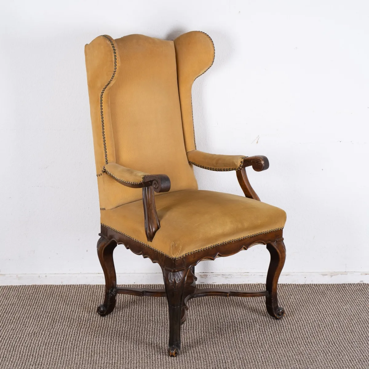 Elegant wingback chair on Louis XV base, 18th/19th c., walnut colour, older restoration, good condition