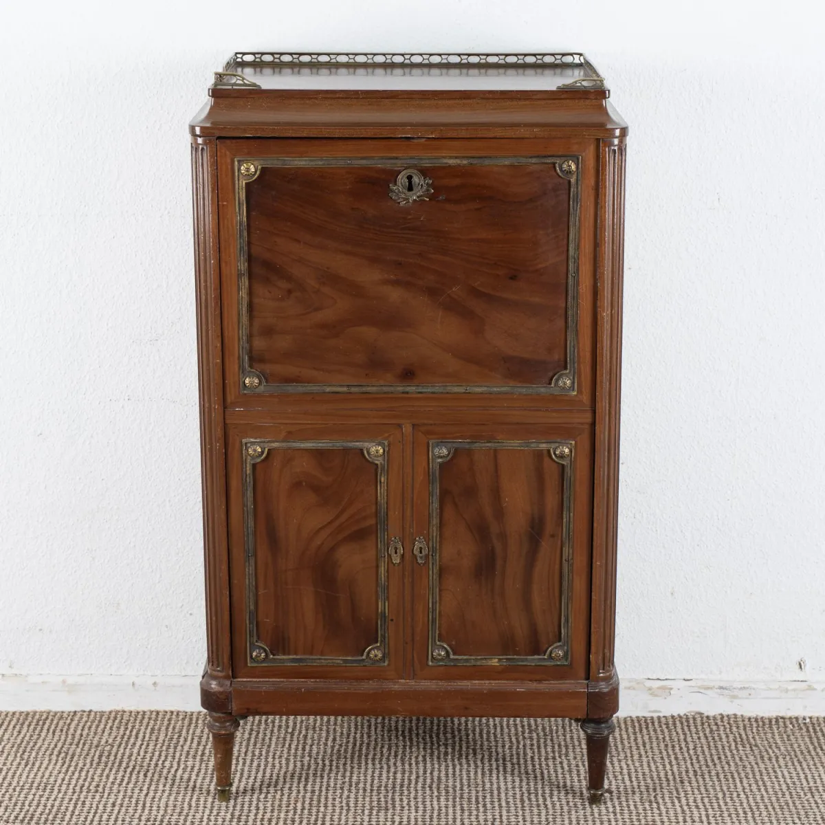 Rare child's cabinet in secrétaire à abattant form, so-called blender. Mahogany, oak body, rich brass