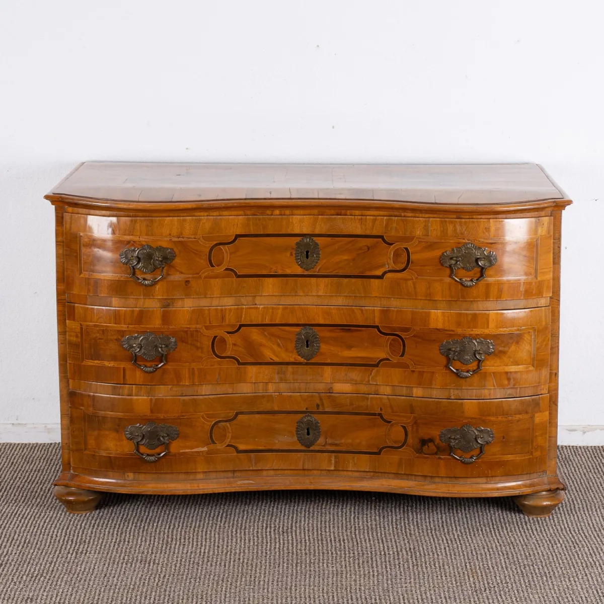 Antique Baroque commode, South German mid-18th century, three-drawer softwood carcass veneered with walnut, top and sides