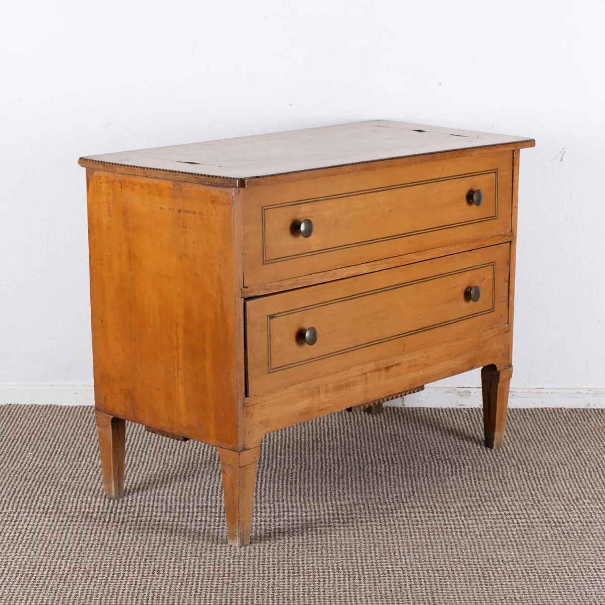 Two-drawer commode, Biedermeier, 19th c., fruitwood, unrestored condition, approx. 75 x 101 x 50 cm.
