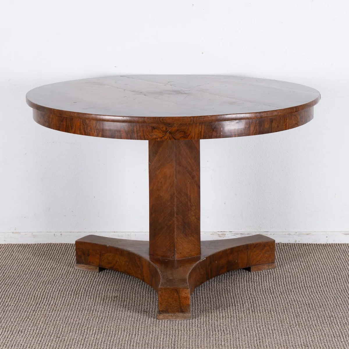 Antique Biedermeier table with star-veneered round top, German circa 1830. Solid walnut and walnut burl