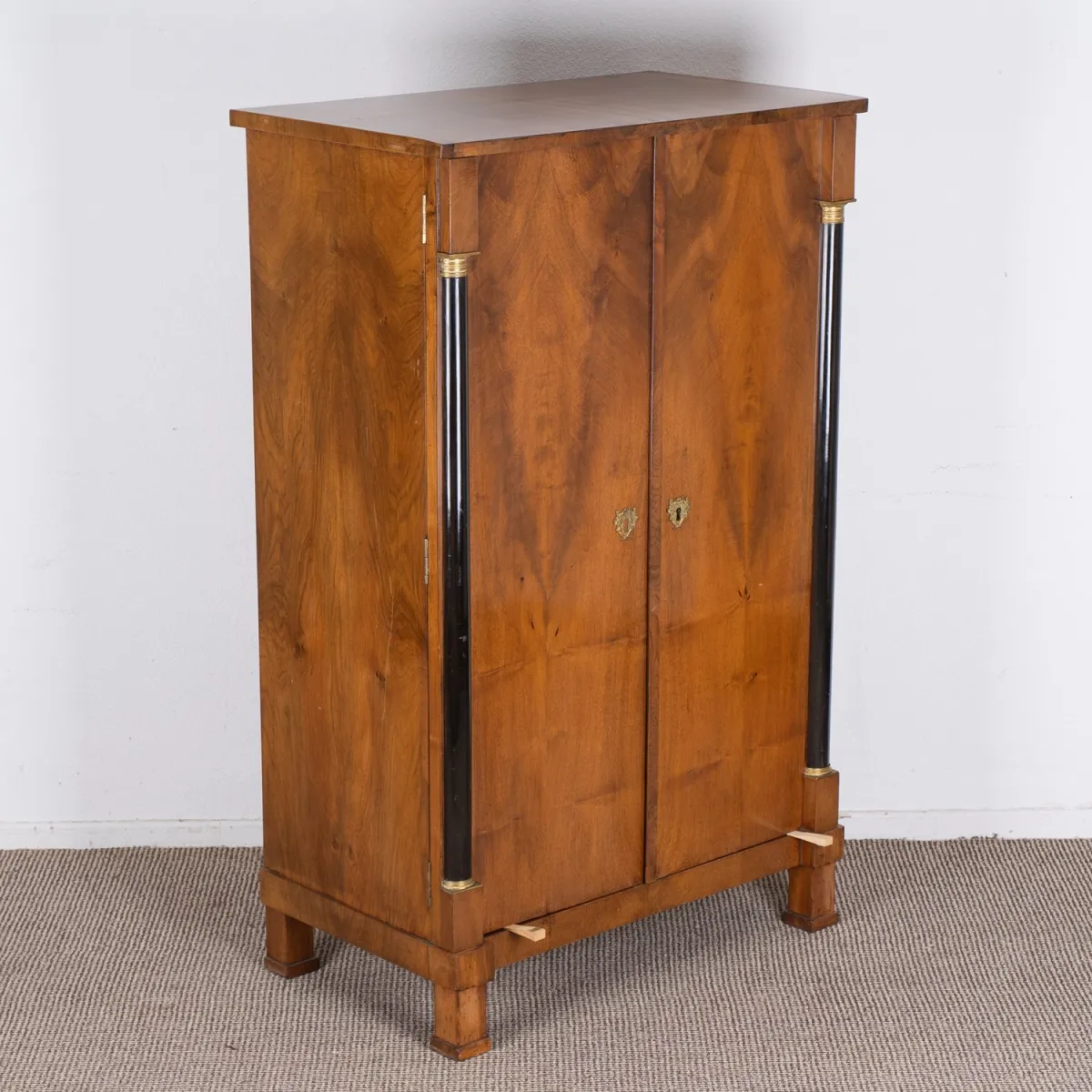 Rare two-door children's wardrobe, Empire early 19th century, solid and veneered walnut, doors ebonized…