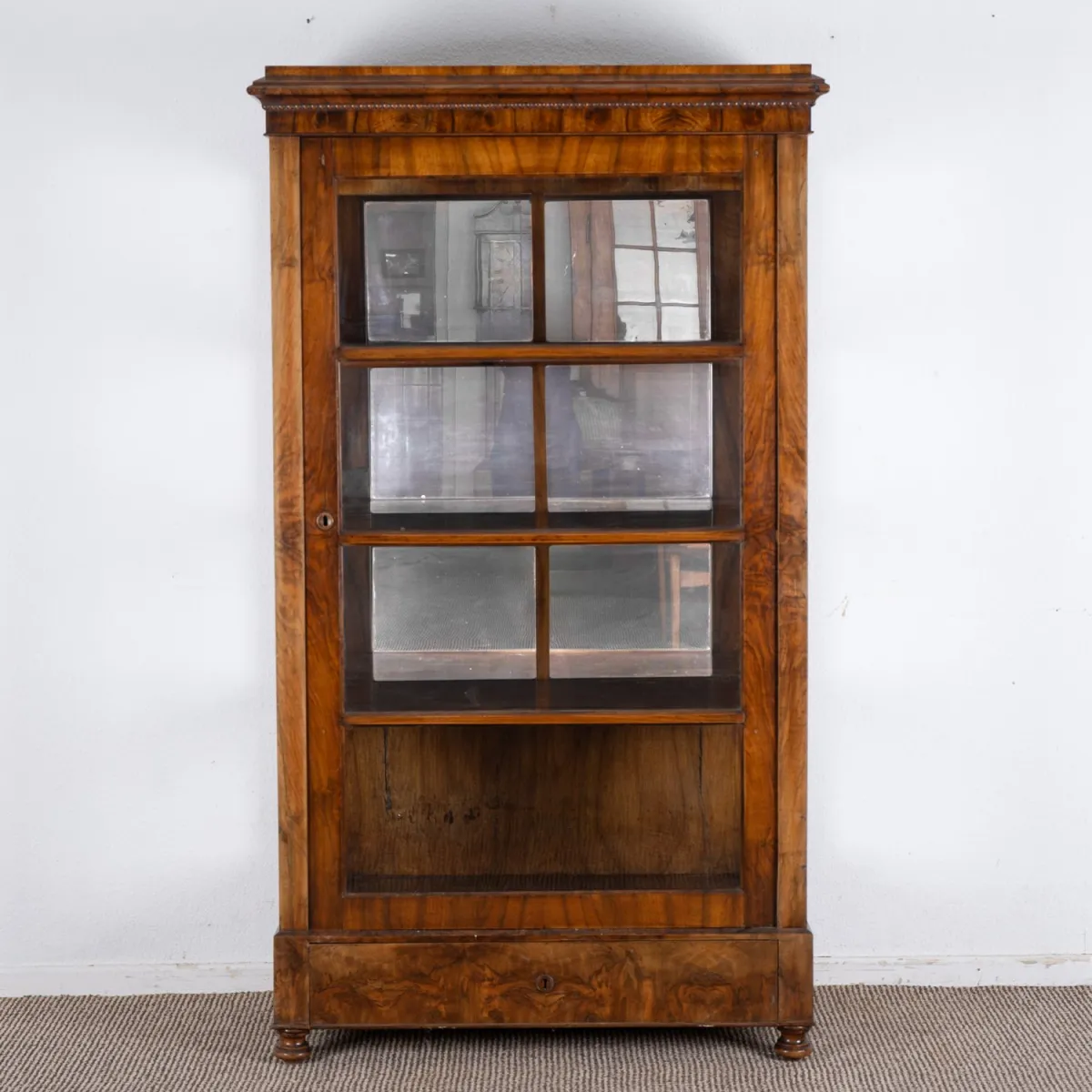 Antique display cabinet, single door with bottom drawer. Glazed on three sides, back 3/4 mirrored. Austria 19th c…