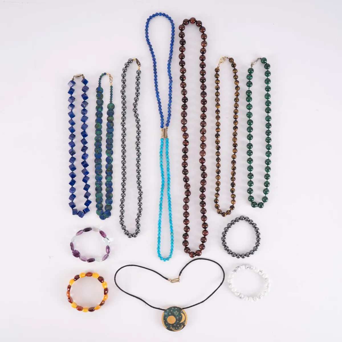 12-piece assortment of various chains and bracelets, mainly semi-precious stones. Various lengths and conditions.