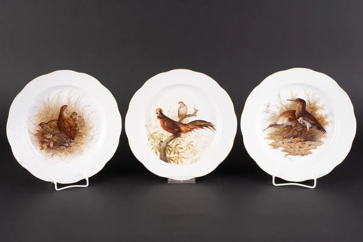 Set of 3 slightly deep plates from KPM Berlin with various feathered game decors. The slightly rising rim…