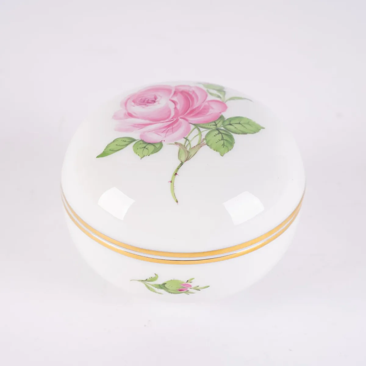Round lidded box, Meissen, crossed swords mark 1st choice, Saxon white porcelain with polychrome rose decor and subtle gold…