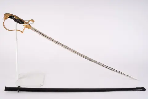 Sabre à tête de lion pour officiers d'artillerie avec canons croisés sur la garde.