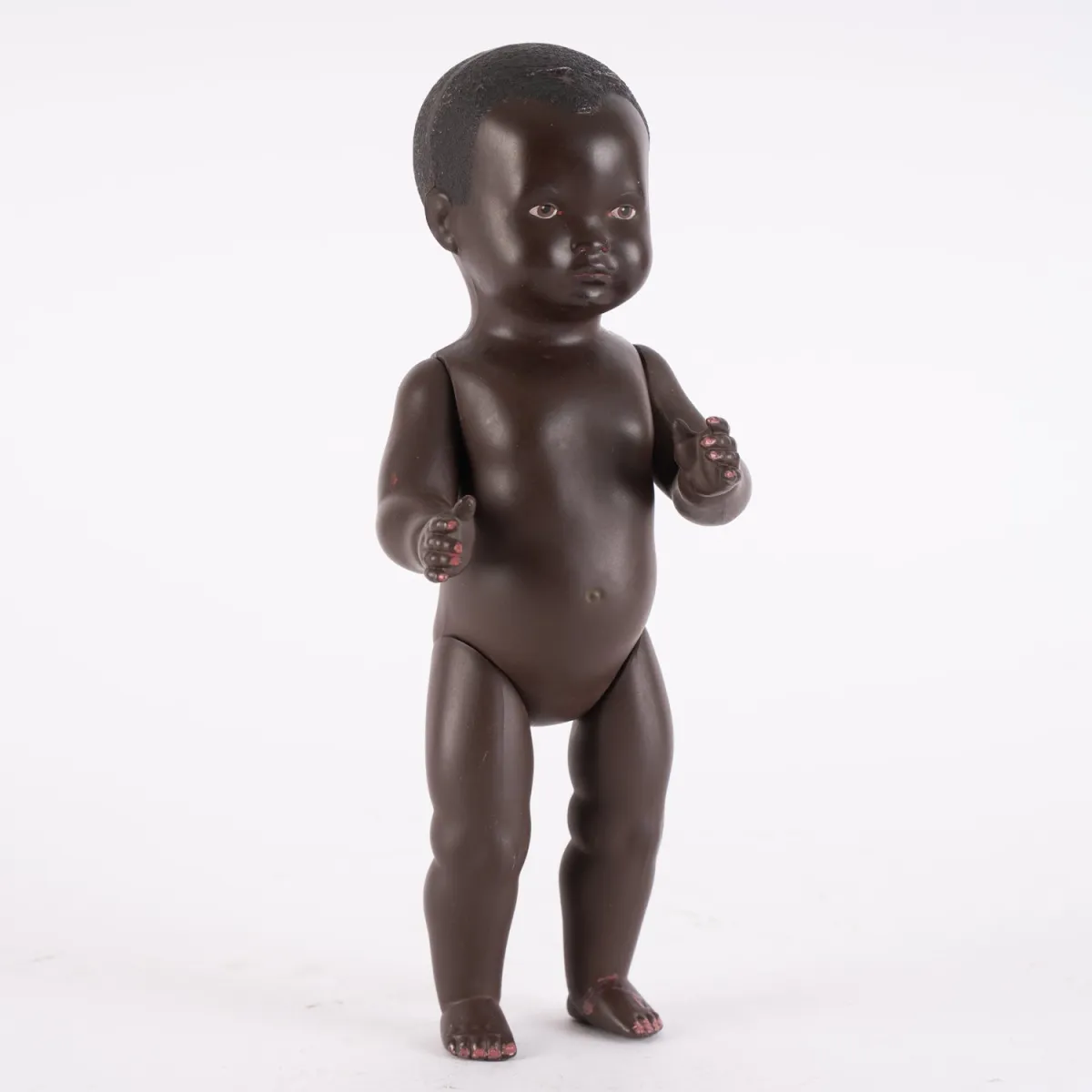 Dark-skinned boy doll, Schildkröt, size 27.5, movable arms and legs, good played-with condition.