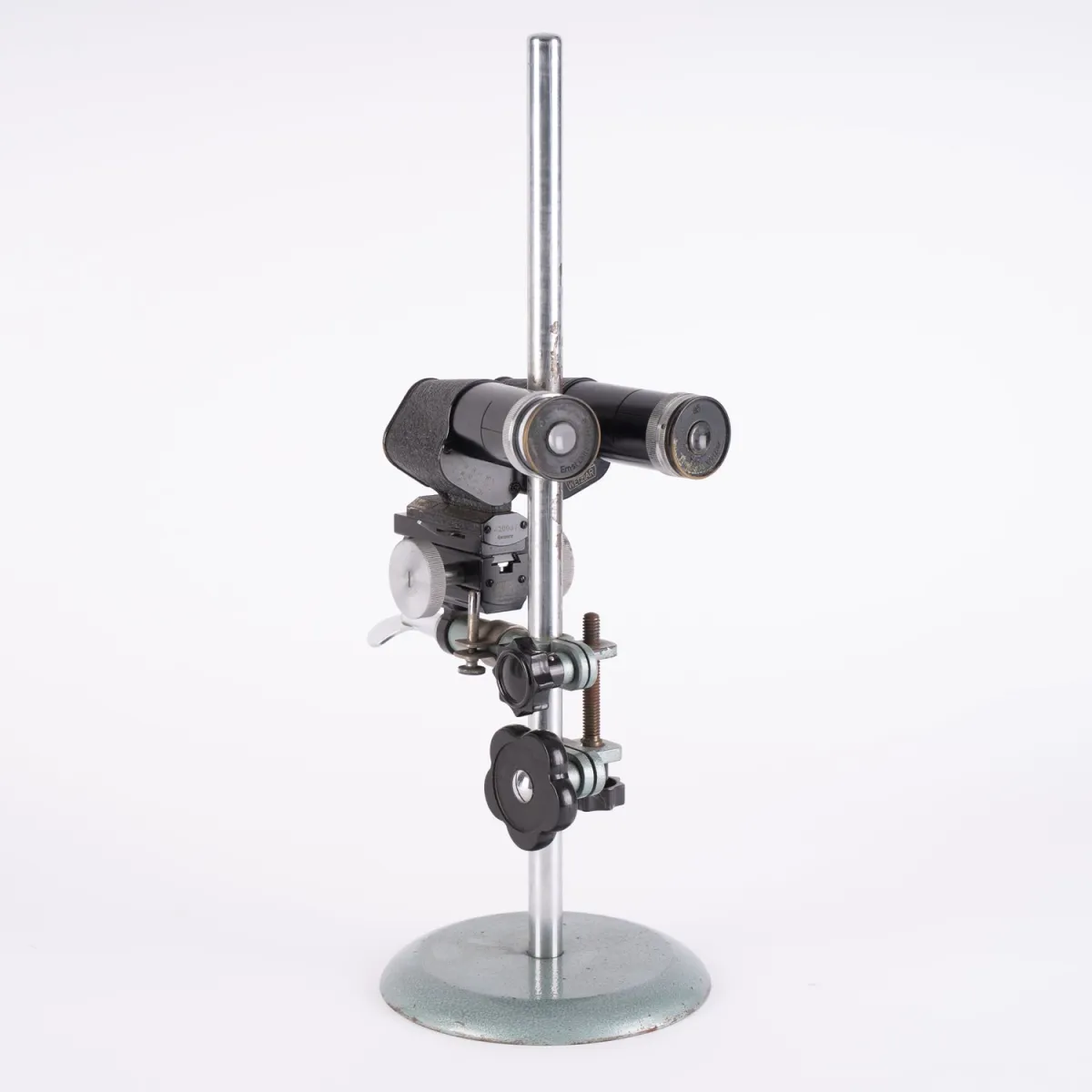 Height-adjustable tripod with binocular-like attachment, from a former optician's shop. Marked: E. Leitz, Wetzl…