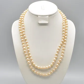 LANGES PERLENCOLLIER, CREME-FARBEN, EINZELN GEKNÜPFT, UM 1950, CA. 120 CM.