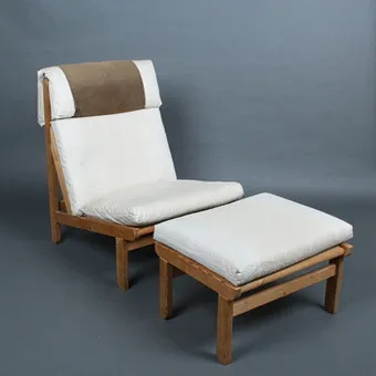 BERNT PETERSEN. Lounge chair with ottoman, "Kludestolen", pine, fabric. 1960s, Denmark.