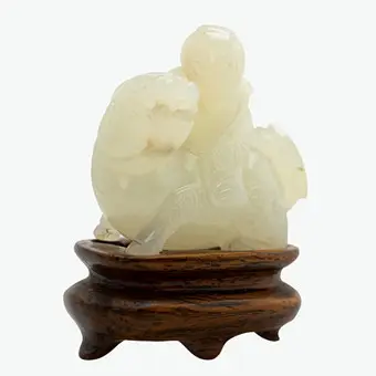 Boy on a mythical beast Qilin as pendant, jade, China, late Qing Dynasty.