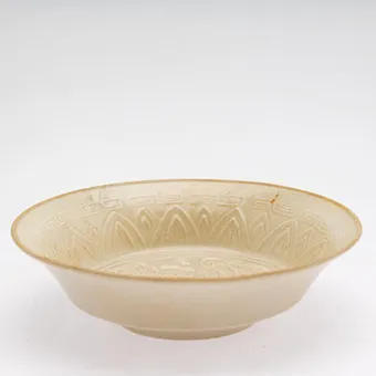 Small bowl with relief floral decor, Ding style, China, 20th c.