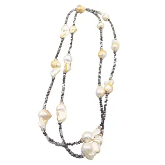 Gefacetteerde hematietstenen en parels, lange ketting met een 925 zilveren sluiting.