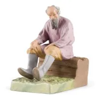 Figurine 'Vieil homme sur un banc en bois'