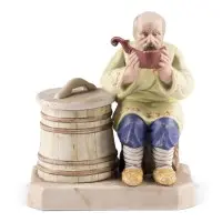 Salière figurine avec un paysan buvant de l'eau à une kovsh