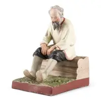 Figurine « Vieil homme sur un banc en bois »
