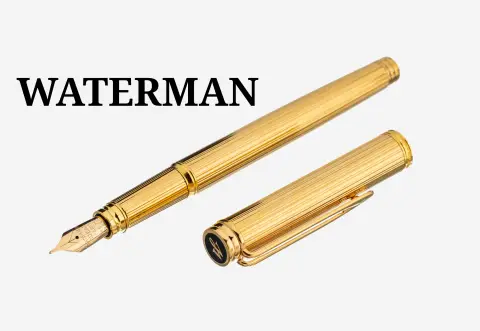 Stylo WATERMAN, métal doré, décor de rainures, plume en or 750/000, L. env. 14 cm
