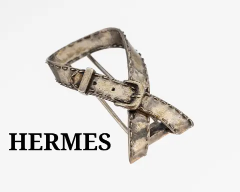 Broche HERMES, argent, représentation d'une ceinture, L. env. 4,5 cm, signée, marquée Made in