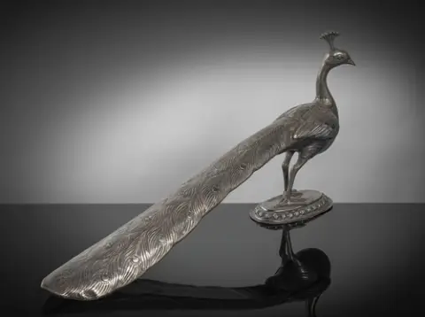 Grand paon en argent