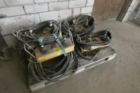Lot of crane control panels with cables