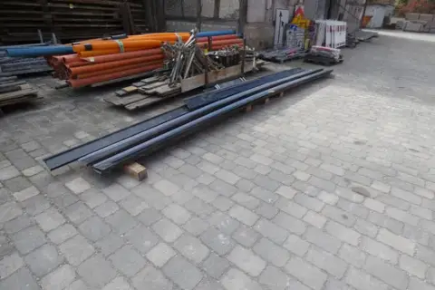 Lot of exterior window flashing with protective film, long on squared timbers