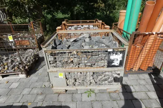 Mesh pallet with rubble stones, dark grey