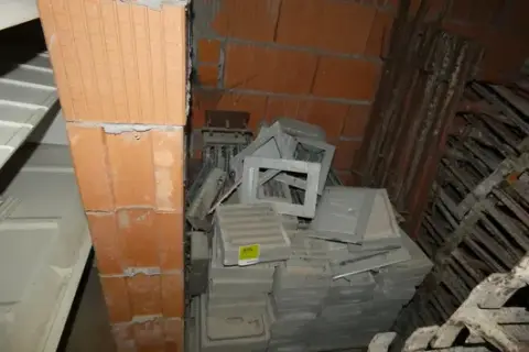 Lot of concrete ventilation grilles, fireplace doors