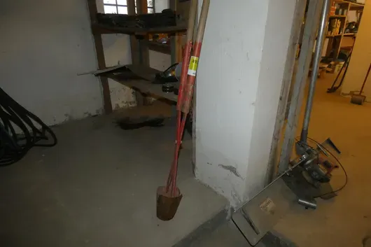 Post hole digger with two handles, red