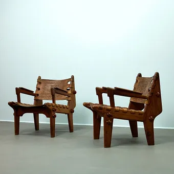 ANGELO PAZMINO. Muebles De Estilo, model Cotacachi, two armchairs / lounge chairs, walnut, leather, Ecuador, 1960s (2).