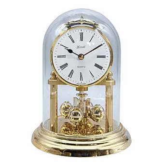 Hermle. Rotating pendulum clock with glass dome - quartz movement.