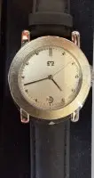 Quartz HAU s emblémem Volksbank, pravděpodobně pro věrné členy, nenošené v originálním pouzdře, zadní ochranná fólie