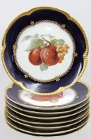 8 fruit plates by Krautheim with various fruit motifs in cobalt blue and gold.