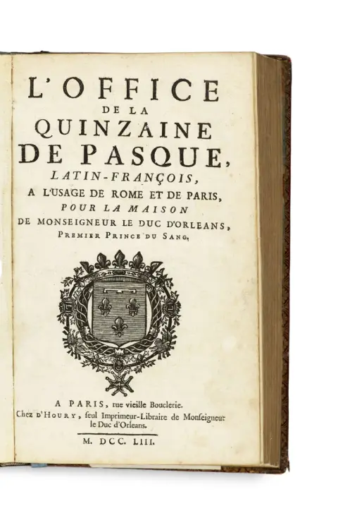 Reliure en cuir bordeaux avec riche dorure au dos, encadrement floral doré