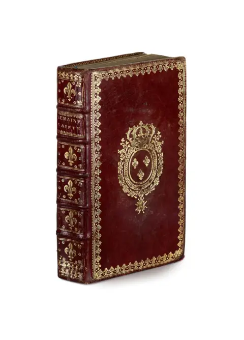 Burgundy leather binding with rich gilt spine, gilt floral border