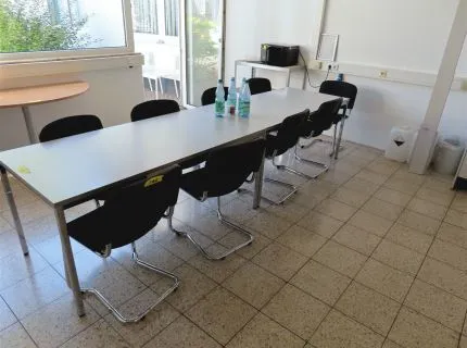 10 cantilever chairs, black fabric upholstery, partly worn