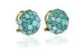 Pair of flower ear clips with turquoises.