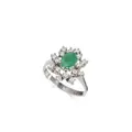 White gold emerald flower ring with brilliant entourage
